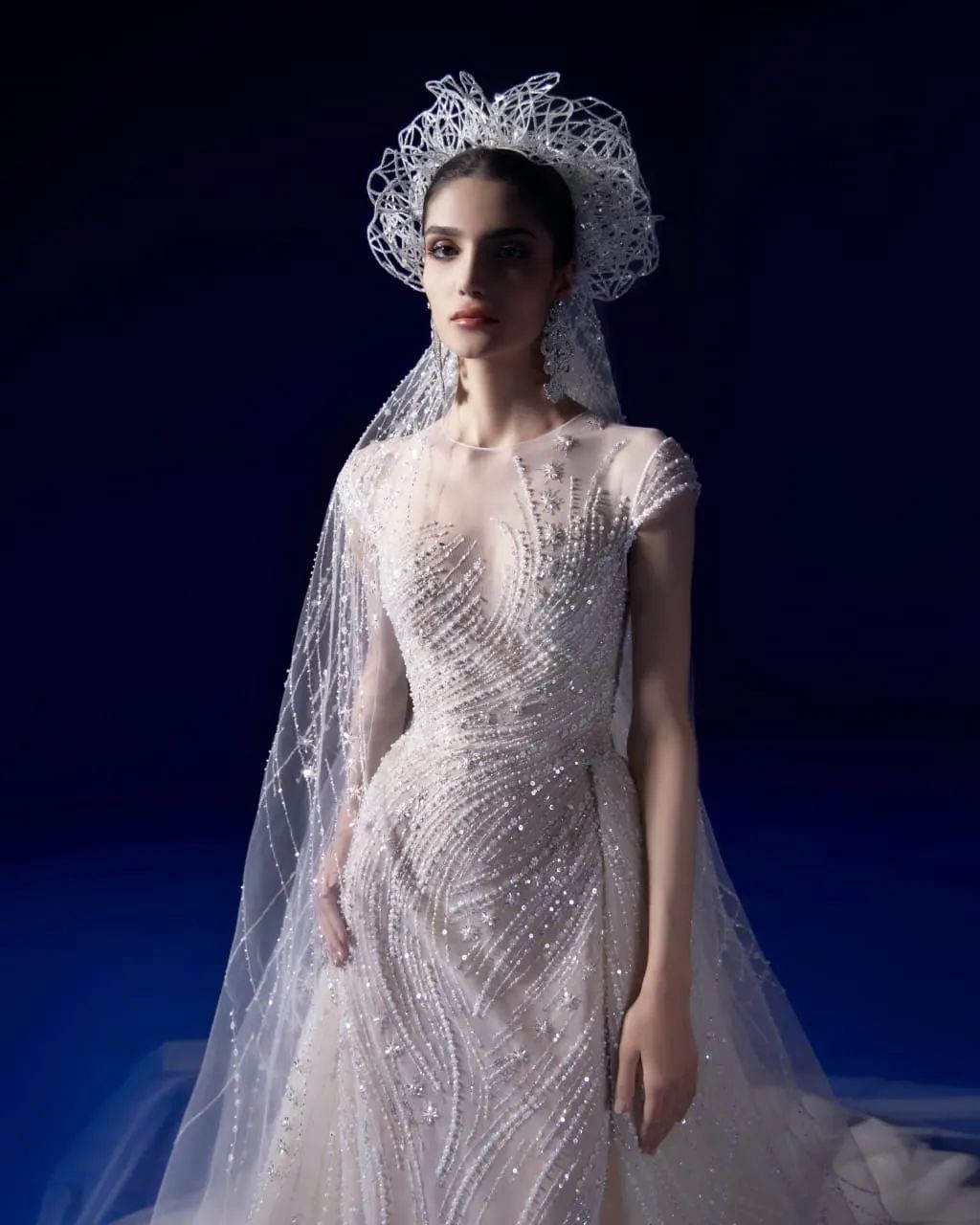 The spring/summer 2024 bridal collection from Maison George Hobeika celebrates women’s inner beauty. The skill of the workshops transforms the power of love to create exquisite gowns adorned with fervour. The House’s renowned expertise is displayed in a variety of cuts that reflect the variety of temperaments and silhouettes, whether they are simple or elegant, playful or bold.True to its Couture roots, the Maison adds extravagant headpieces and cascading veils to each design.