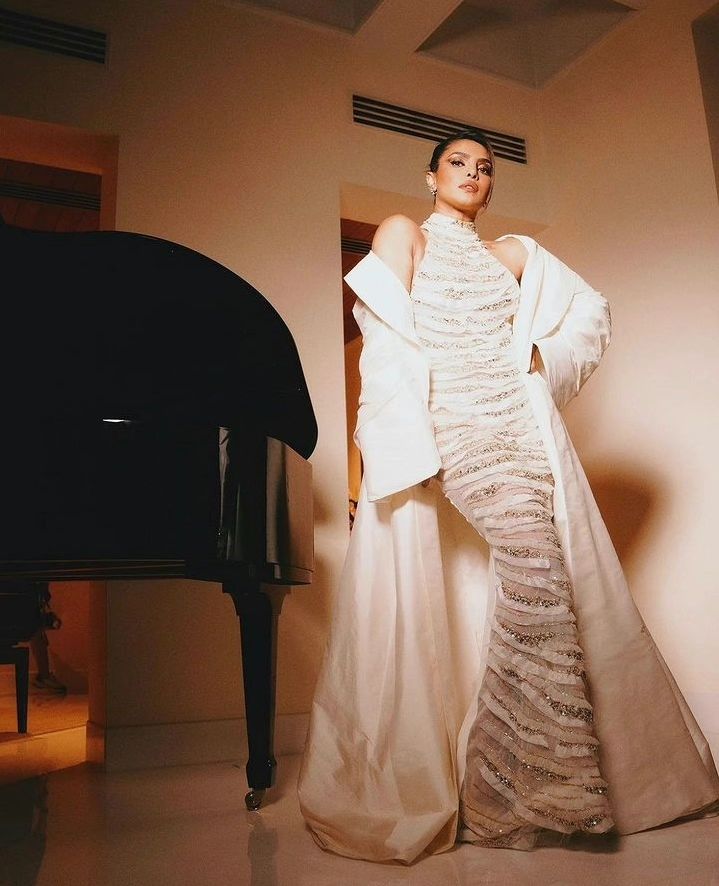 Wearing a shimmering gown by Lebanese designer Tony Ward