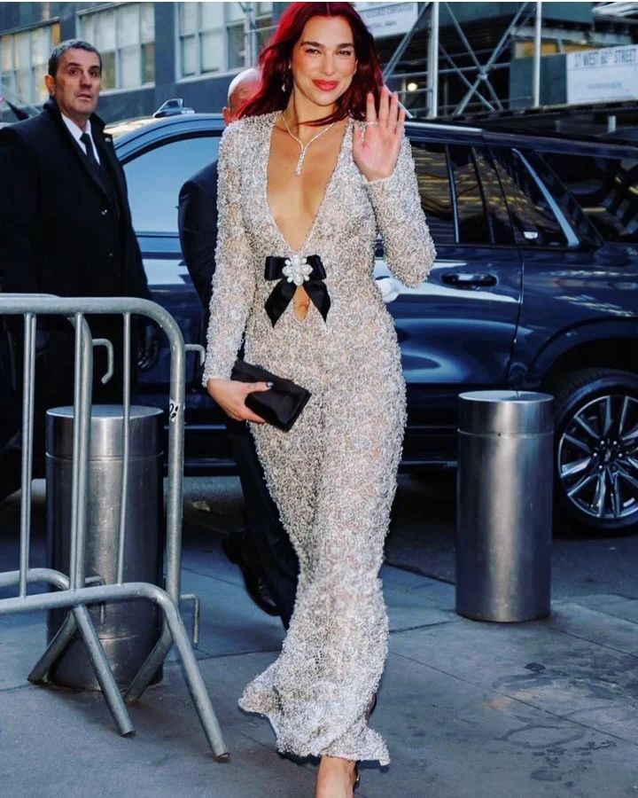 Dua Lipa steps out yesterday in custom Chanel lace dress in New York 🤍