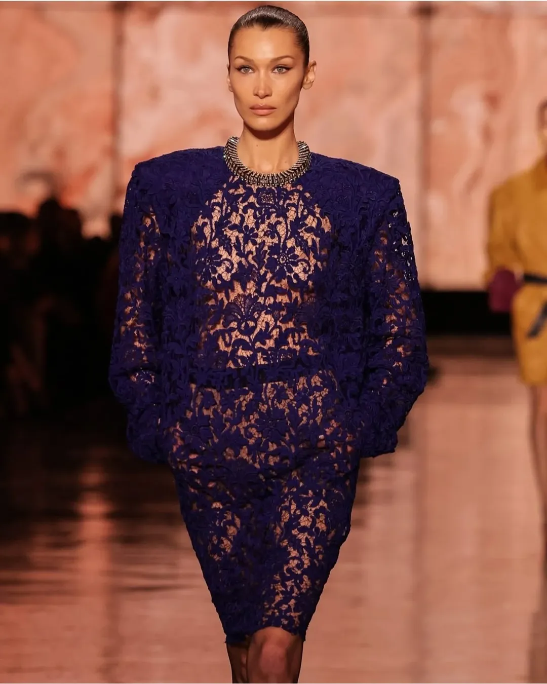 Yesterday Saint Laurent’s Fall/Winter 2025-2026 show illuminated Paris Fashion Week with a bold statement: “more is more.” Held near the iconic Eiffel Tower, the event showcased Creative Director Anthony Vaccarello’s daring vision, blending vibrant colors with structured designs that captivated the audience.