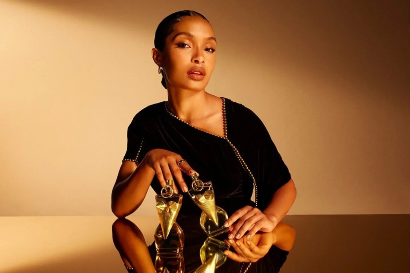 Yara Shahidi embodies radiance for Jean Paul Gaultier’s latest “Divine” elixir.The actress takes center stage in the French house’s new campaign, alongside Raphael Diogo, for a reimagined take on its 2023 fragrance.
